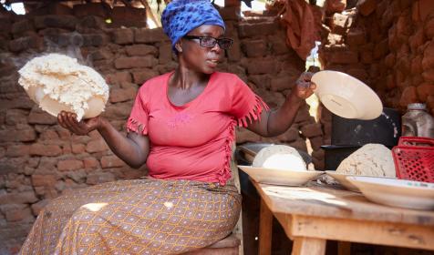Woman bakes ugali in Burundi