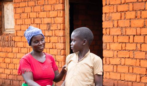 Mother sending a child off to school