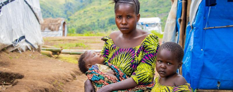 Chance and two of her young daughters at Katashola camp in Kalehe, DRC