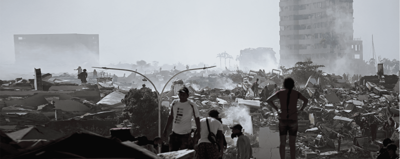 Volunteers search for survivors in a collapsed building following the twin earthquakes in La Guaira state, Venezuela.
